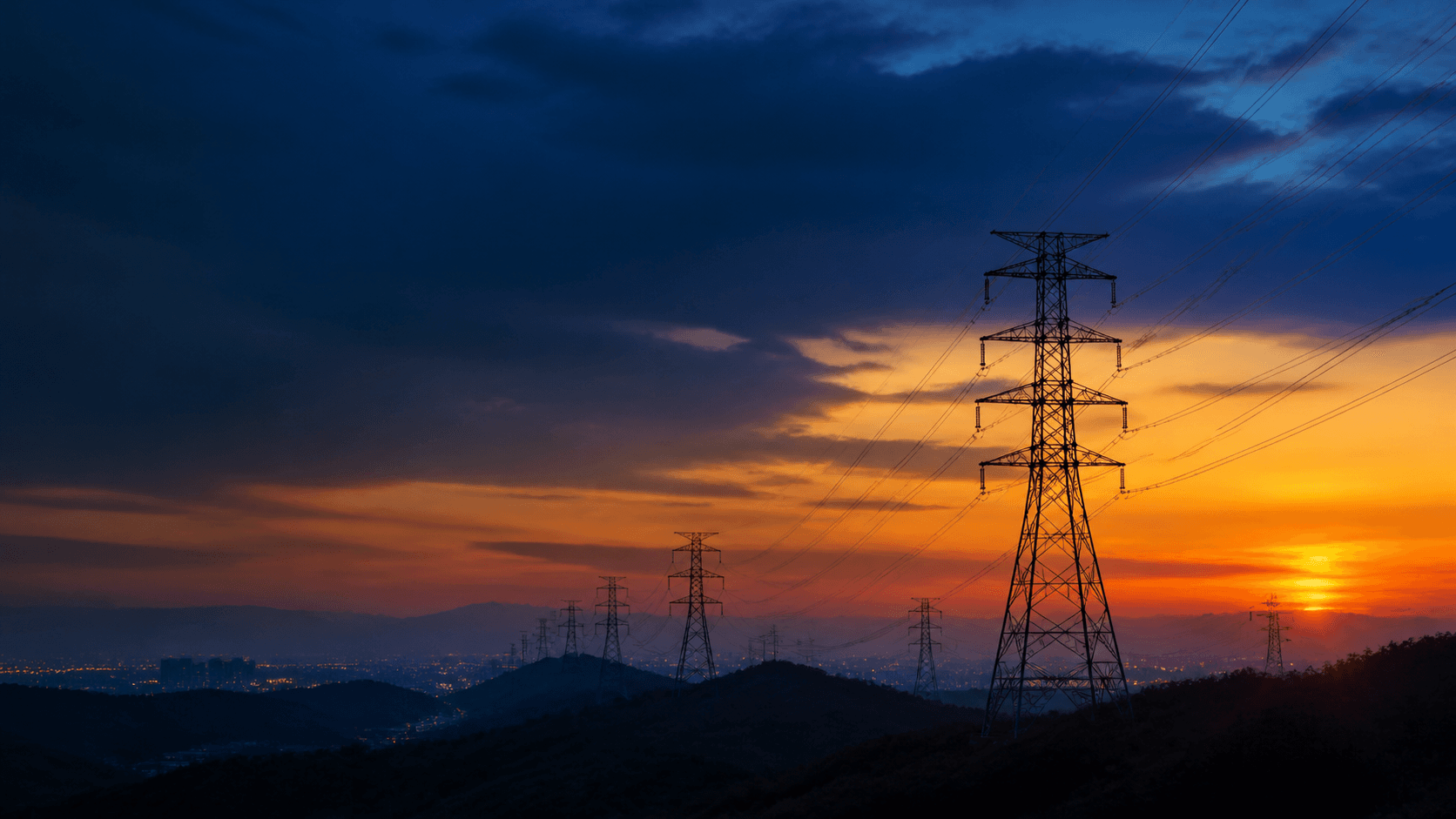 Electric transmission towers at sunset